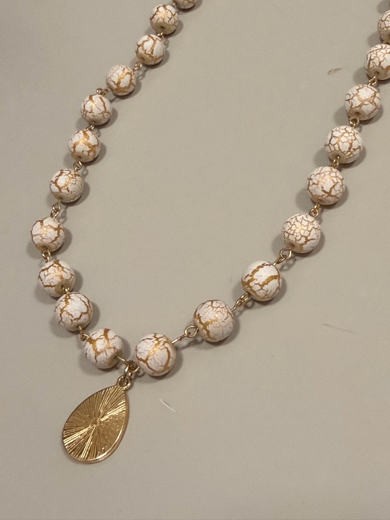 White And Gold Beaded Necklace With Gold Teardrop Charm